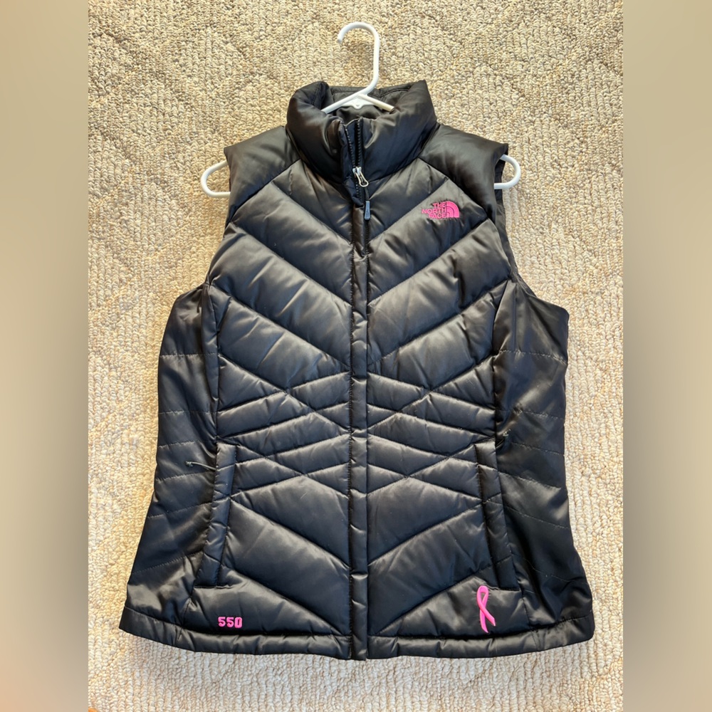The North Face black 550 goose down puffer vest. Breast cancer logo. Size large